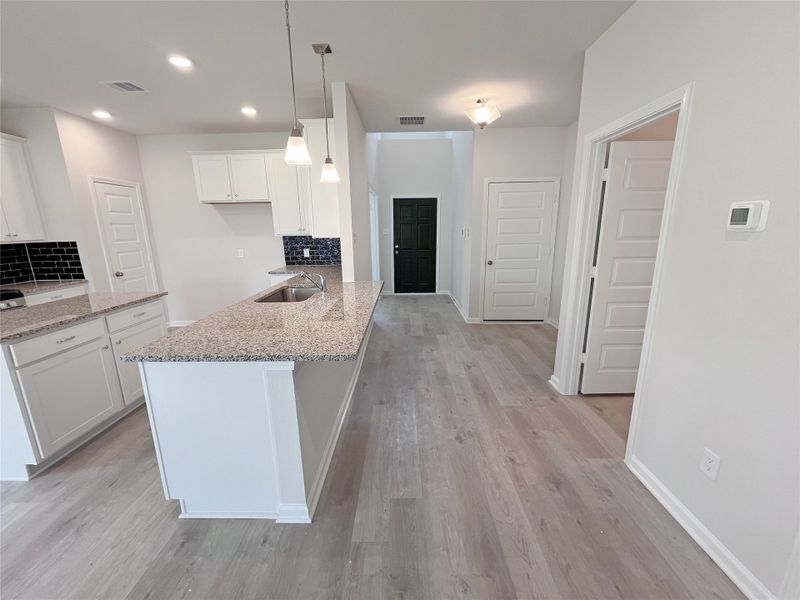 The Georgetown II- Kitchen and Foyer. Sample image for illustration; upgrades, options, and colors may vary. The Georgetown II- Kitchen and Foyer. Sample image for illustration; upgrades, options, and colors may vary.