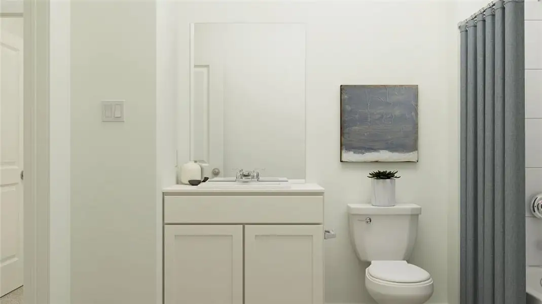 Bathroom featuring vanity and toilet Bathroom featuring vanity and toilet