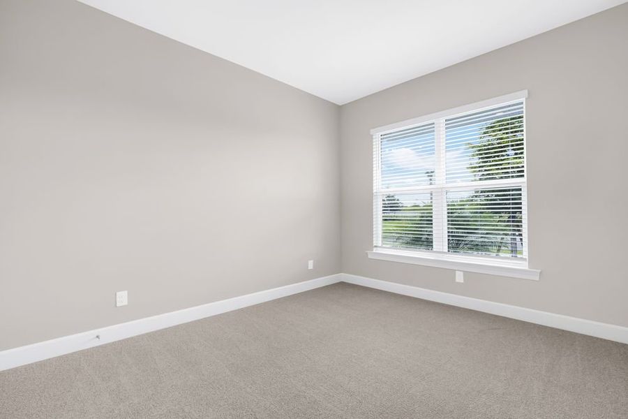Spacious, unfurnished interior of a new home in Esplanade at Starling, Punta Gorda (Image 13).