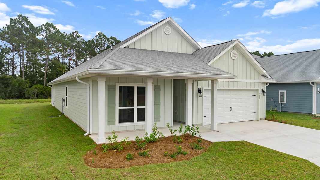 Front exterior of a new home in Buffer Farms, Port Saint Joe, FL, highlighting curb appeal (Image 18). Front exterior of a new home in Buffer Farms, Port Saint Joe, FL, highlighting curb appeal (Image 18).