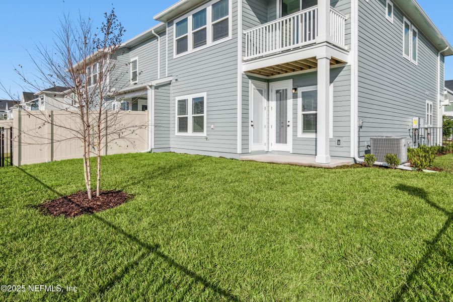 Exterior details and patio area of a home in Kettering at eTown - Traditional Collection, Jacksonville (Image 18).