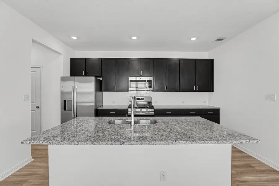 Furnished interior view inside a new home in Sunfield, Buda (Image 18).