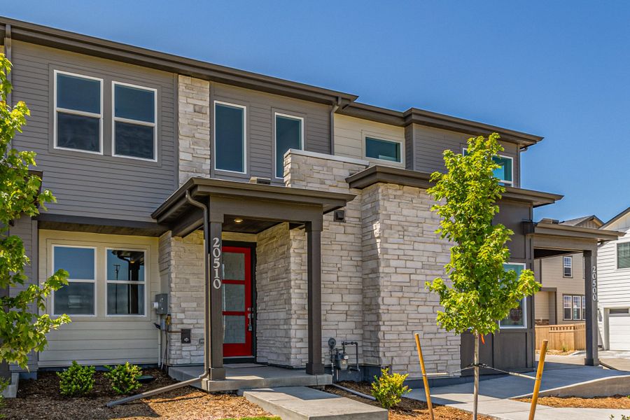 Front exterior of a new home in Painted Prairie, Aurora, CO, highlighting curb appeal (Image 20).