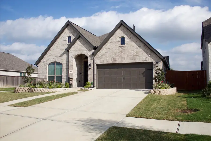 Front exterior of a new home in , Manvel, TX, highlighting curb appeal (Image 4).