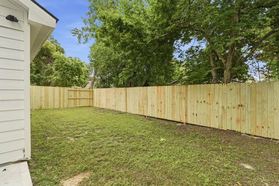 Spacious back yard with brand new privacy fence