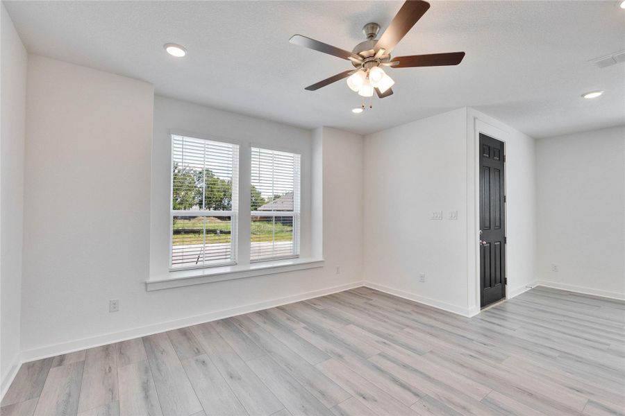 Spare room featuring light wood-type flooring, recessed lighting, and ceiling fan Spare room featuring light wood-type flooring, recessed lighting, and ceiling fan