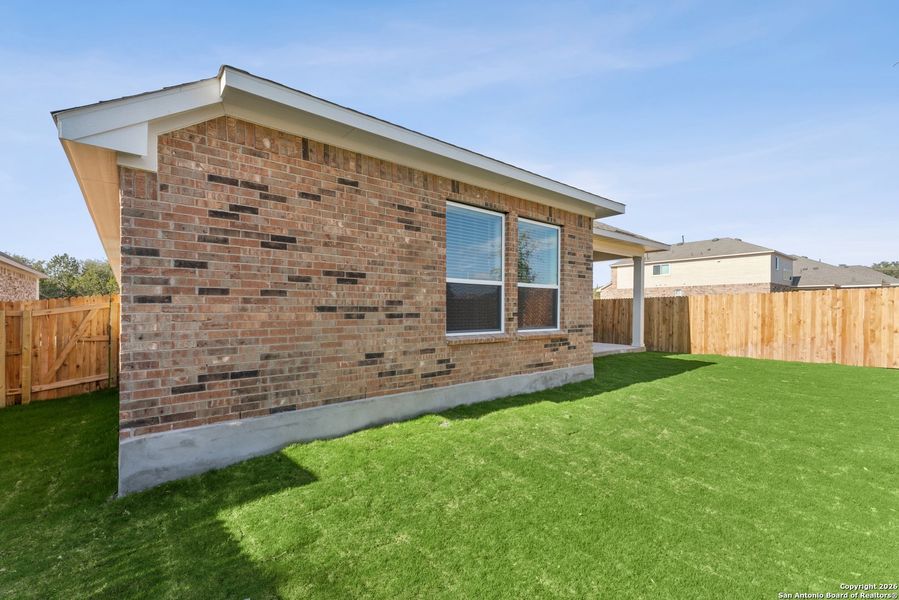 Exterior details and patio area of a home in Davis Ranch 50', San Antonio (Image 19).