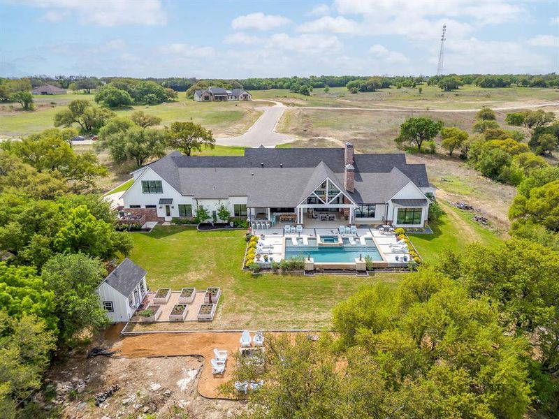 A great shot that encompasses the almost 3-acre property. This neighborhood is quiet yet has quick access to everything. Actually, you can bypass Hwy 377 if you need to get to  Ft. Worth or Dallas via SH 67. Miss all of the traffic with this route!