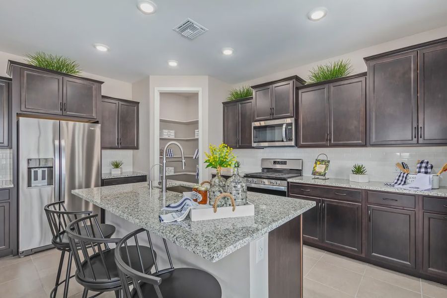 Representative furnished interior of a home built from the 1603 by Elliott Homes in Acacia at Santana, Yuma (Image 10).