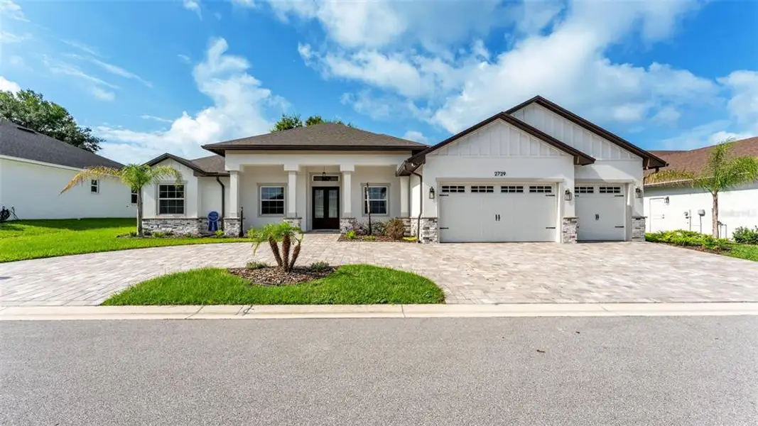 Front exterior of a new home in , Lakeland, FL, highlighting curb appeal (Image 26).