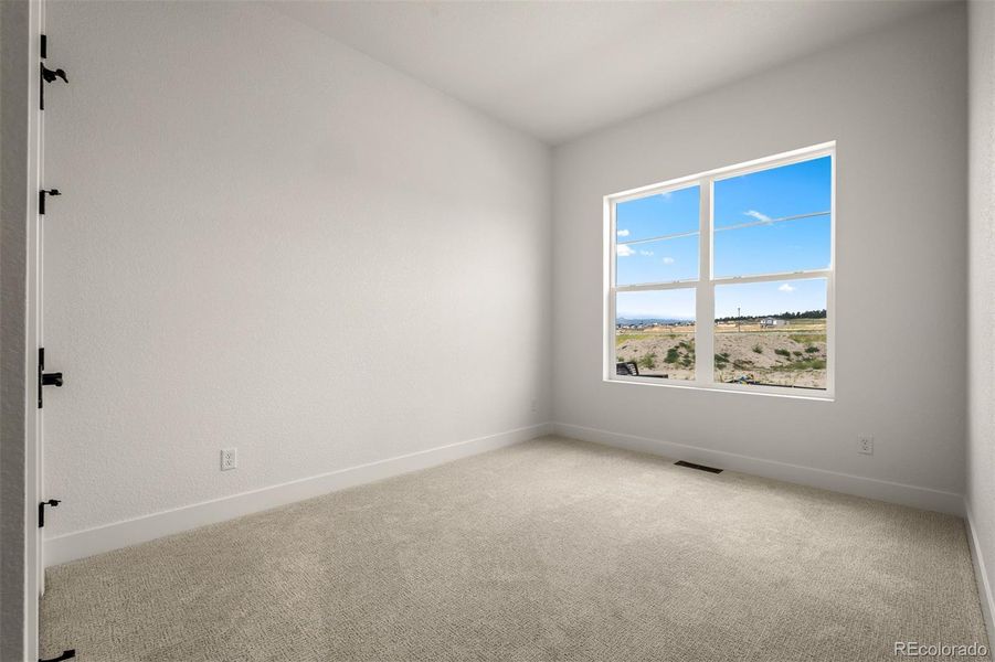 Spacious, unfurnished interior of a new home in Wolf Ranch - Enclave Collection, Colorado Springs (Image 34).