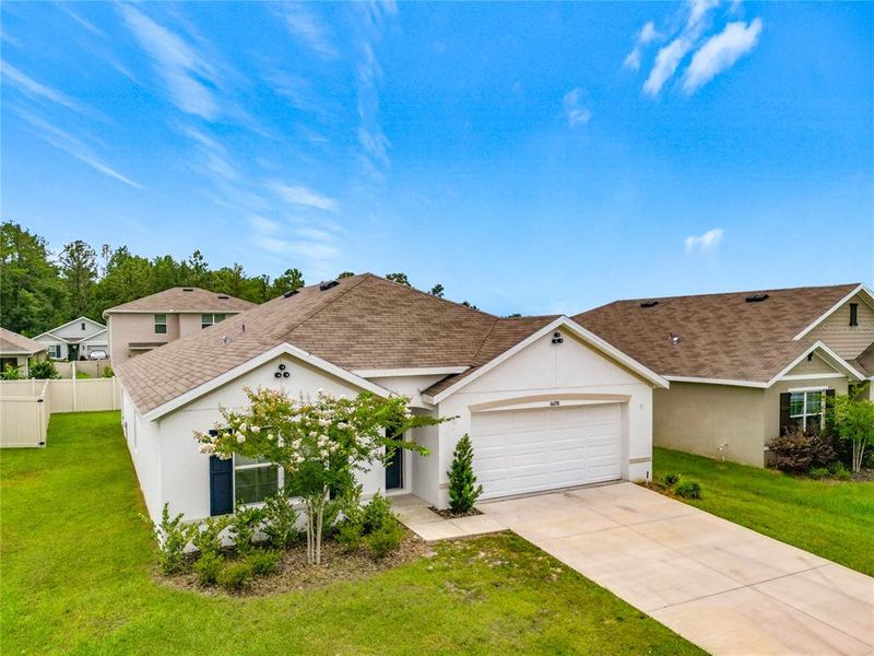 Front exterior of a new home in , Ocala, FL, highlighting curb appeal (Image 2). Front exterior of a new home in , Ocala, FL, highlighting curb appeal (Image 2).