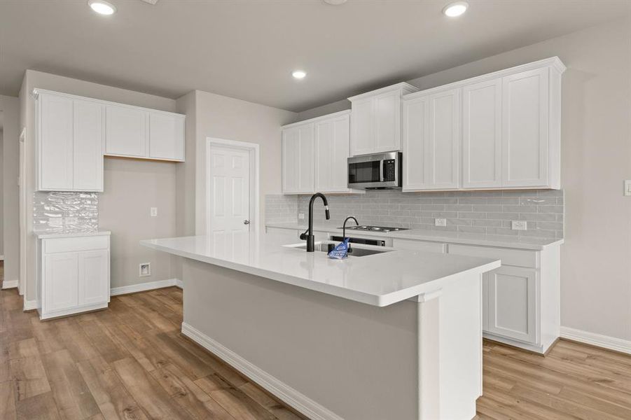 This kitchen is not only a functional space but also has ample storage. Whether you're a seasoned chef or just love to gather and enjoy good food, this kitchen is a dream come true.