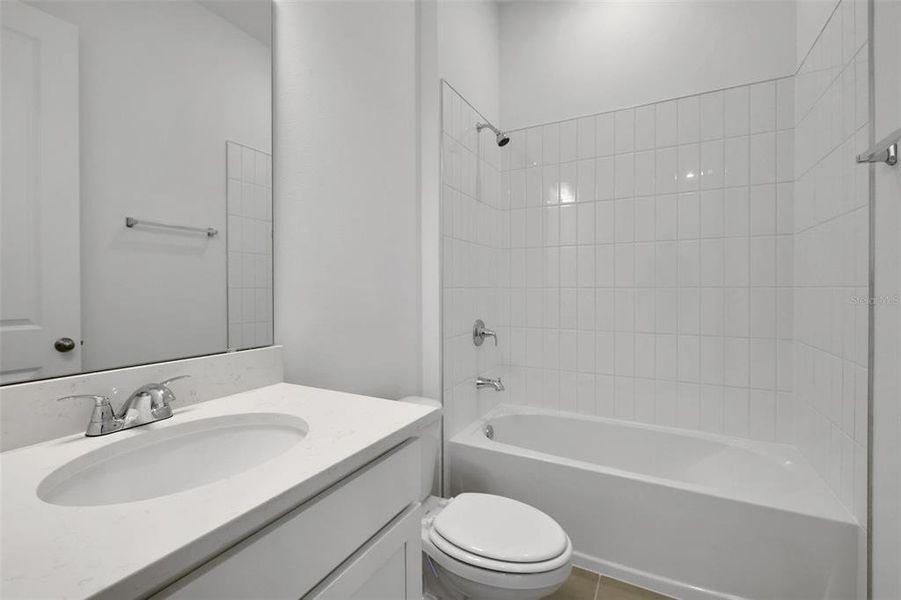 Furnished interior view inside a new home in Serenade at Ovation, Winter Garden (Image 11).