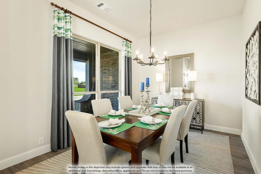 Dining room with dark wood table, six upholstered chairs, chandelier, and large window with gray curtains
