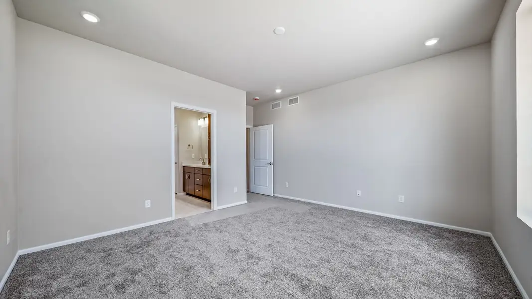 Spacious, unfurnished interior of a new home in The Reserve at Green Valley Ranch, Aurora (Image 20).
