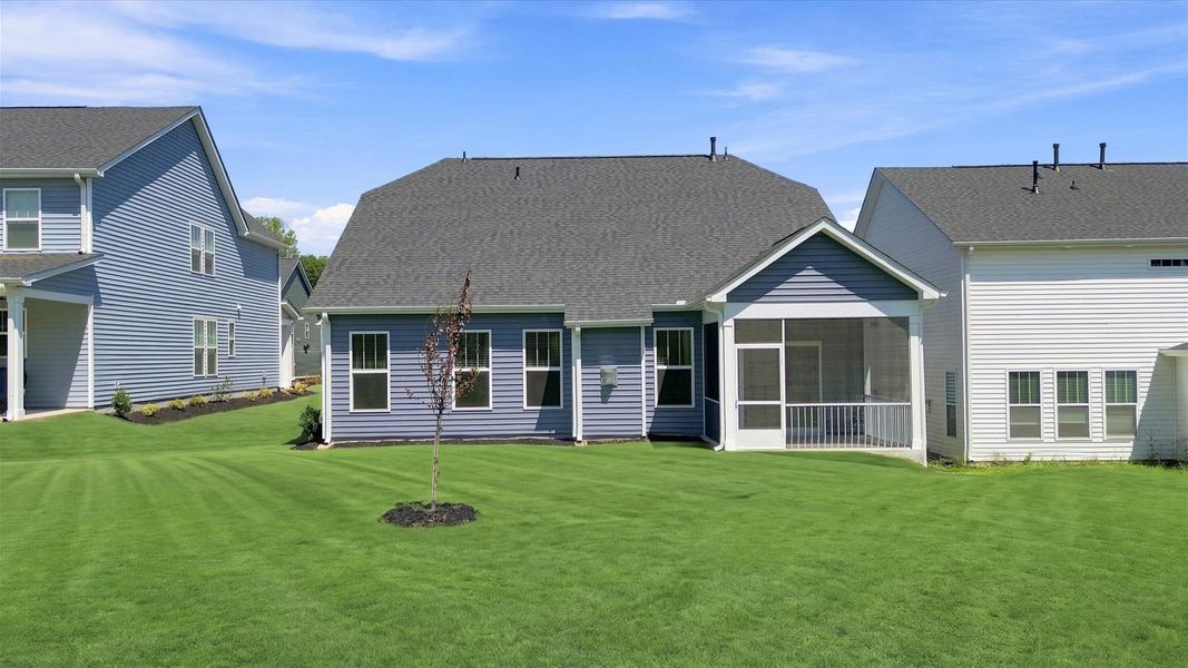 Superior curb appeal continues to the back with a refined, covered outdoor living space located in Fox Hollow