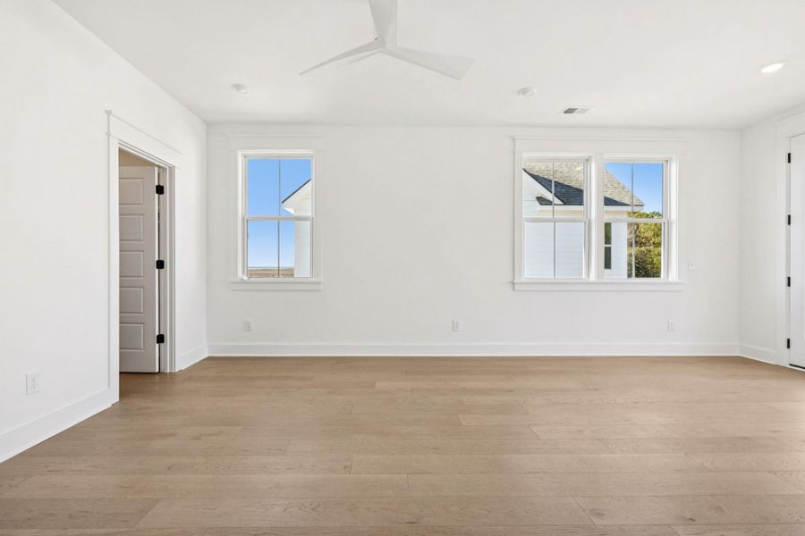 Spacious, unfurnished interior of a new home in Overlook at Copahee Sound, Awendaw (Image 65).