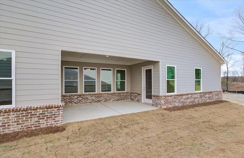 Front exterior of a new home in Courtyards at Traditions, Cumming, GA, highlighting curb appeal (Image 19).
