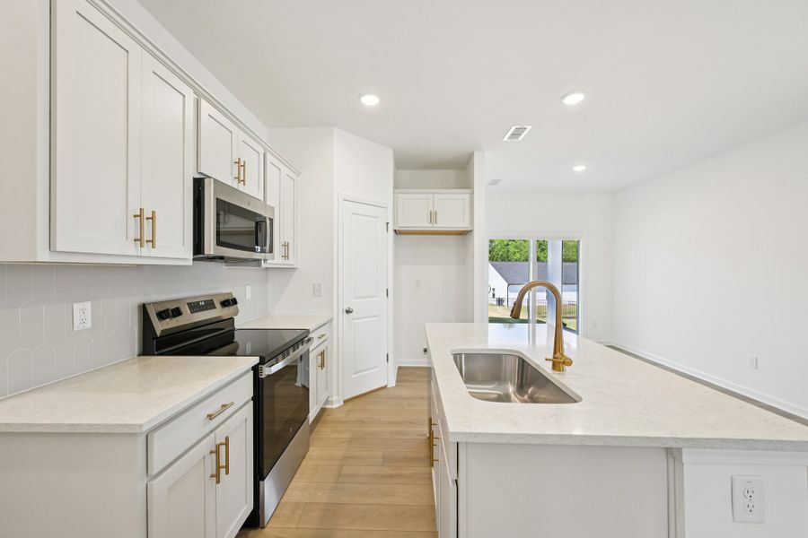 Representative furnished interior of a home built from the Grove by Ashton Woods in Middleton Farms, Middlesex (Image 8).