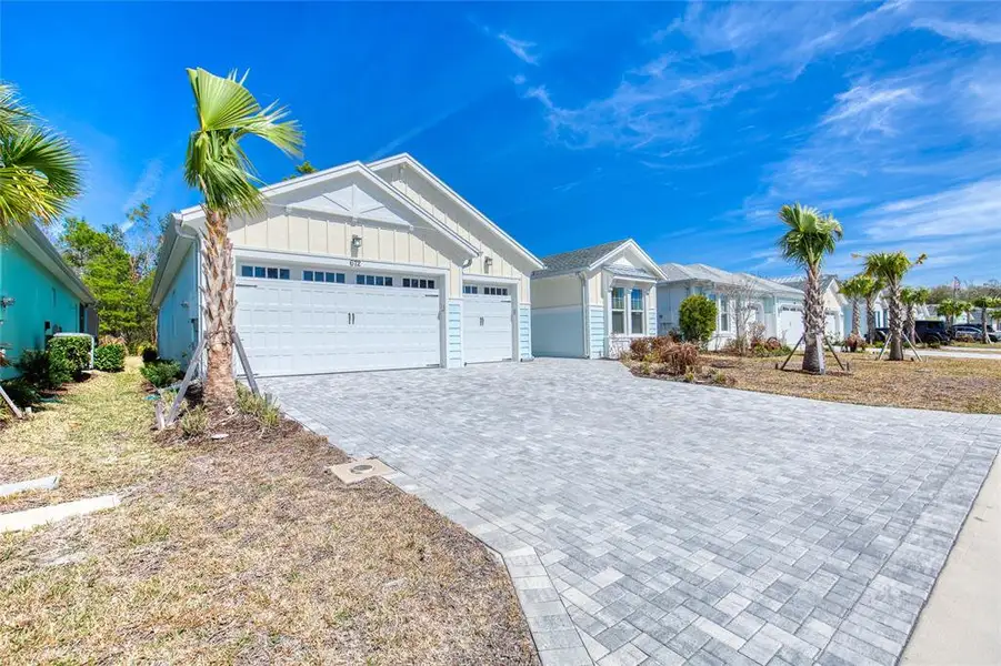 Front exterior of a new home in , Daytona Beach, FL, highlighting curb appeal (Image 28).