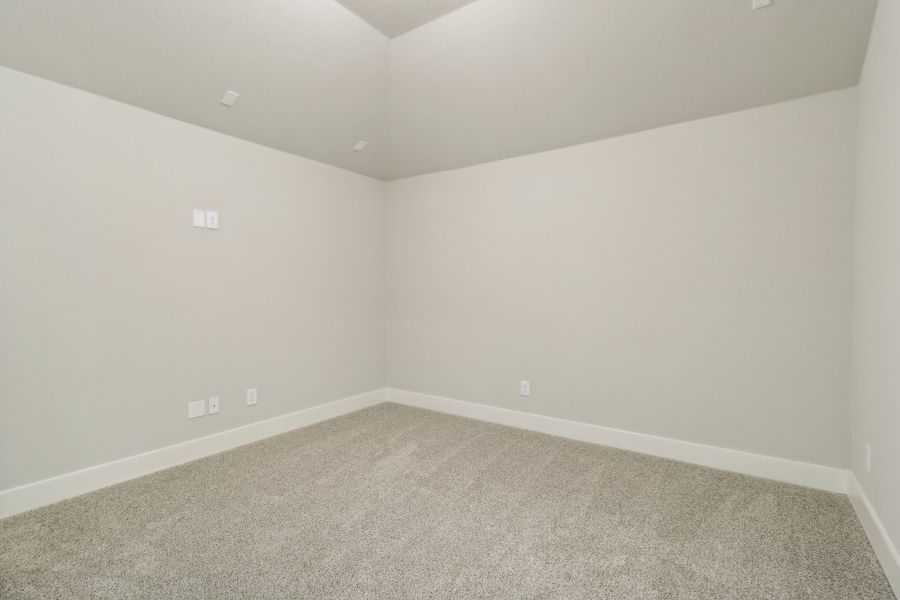 Guest bedroom in the Cedar floorplan at a Meritage Homes community.