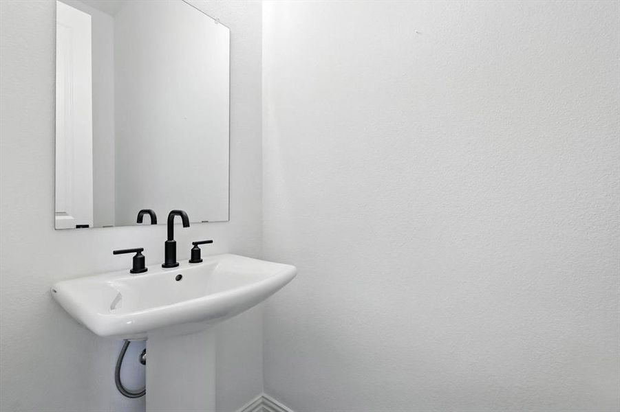 And to make entertaining easy, a half bath for your convenience opposite the pantry.