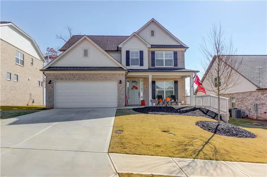 Front exterior of a new home in Cambridge, Flowery Branch, GA, highlighting curb appeal (Image 2).