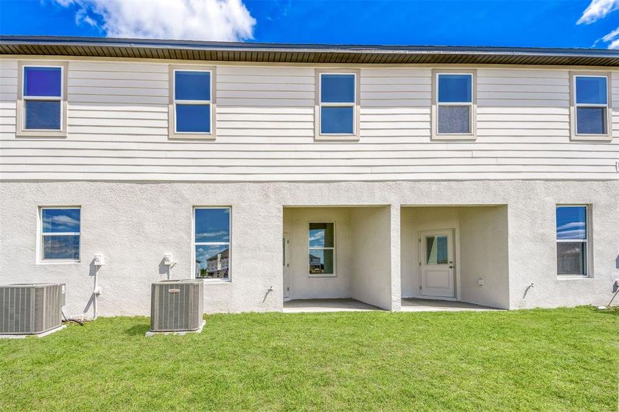 Exterior details and patio area of a home in Sol Vista, Dundee (Image 3).
