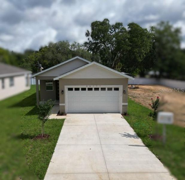 Front exterior of a new home in , Dade City, FL, highlighting curb appeal (Image 19).
