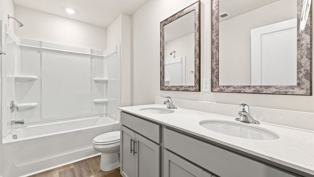 Furnished interior view inside a new home in Bentley Park, Greenwood (Image 10).