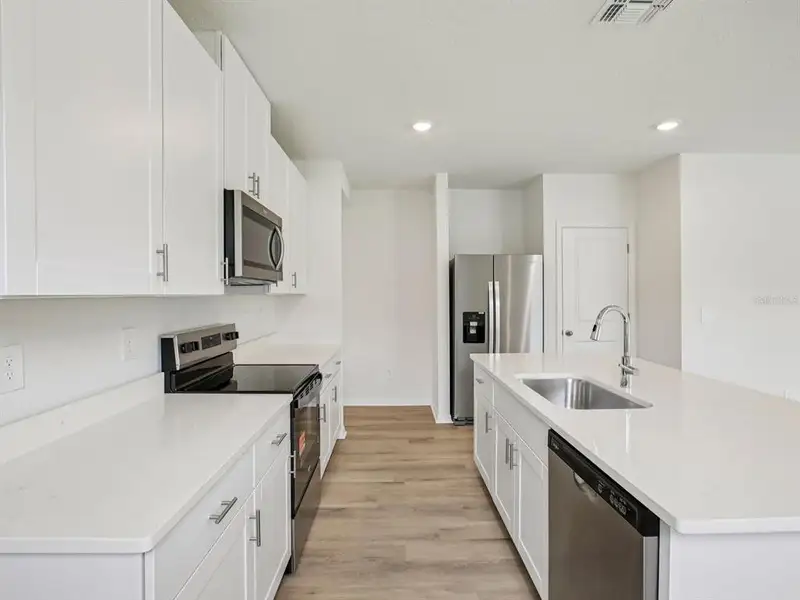 Furnished interior view inside a new home in Oakfield Trails - Premier Series, Parrish (Image 8).