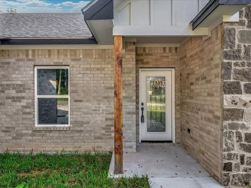 Front exterior of a new home in , Lufkin, TX, highlighting curb appeal (Image 18).