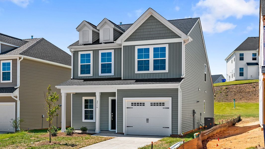 Front exterior of a new home in Hanes Lake, Winston-Salem, NC, highlighting curb appeal (Image 23). Front exterior of a new home in Hanes Lake, Winston-Salem, NC, highlighting curb appeal (Image 23).