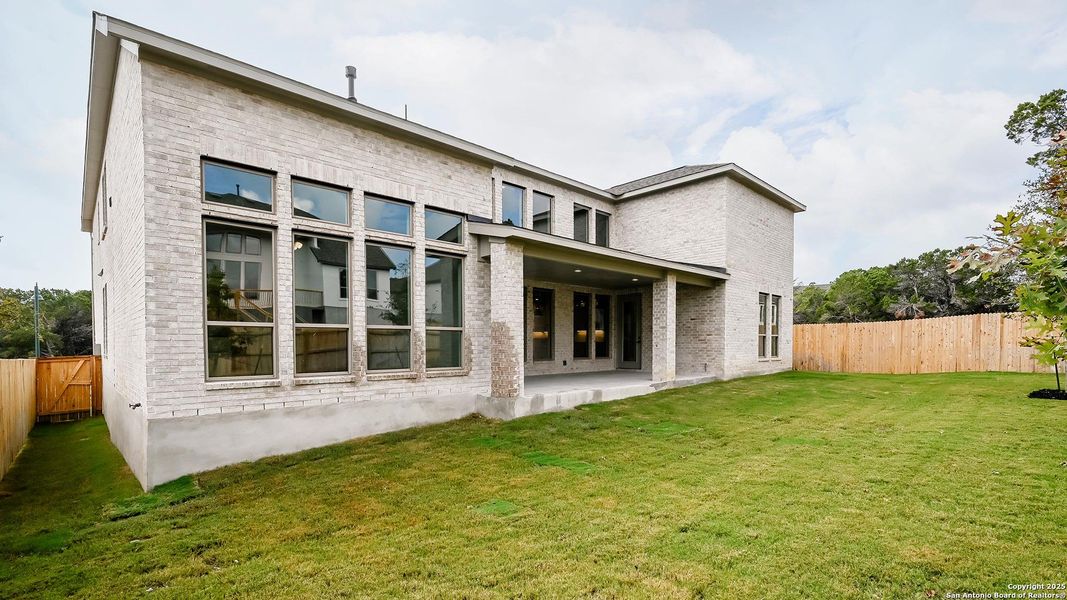 Exterior details and patio area of a home in Kinder Ranch 70', San Antonio (Image 2). Exterior details and patio area of a home in Kinder Ranch 70', San Antonio (Image 2).