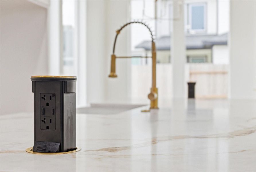 Pop-up island outlets-  a clean, modern upgrade that blends style and function effortlessly.