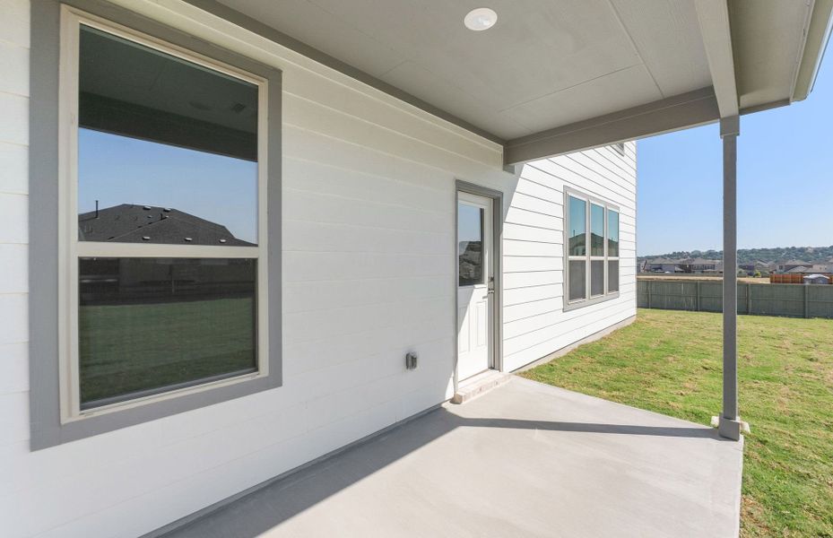 Exterior details and patio area of a home in Saddleback at Santa Rita Ranch, Liberty Hill (Image 32). Exterior details and patio area of a home in Saddleback at Santa Rita Ranch, Liberty Hill (Image 32).