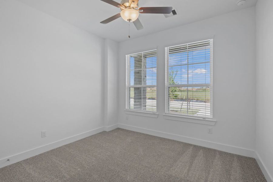 Representative unfurnished interior of a home built from the Carriagehouse by Chesmar Homes in Meridiana Townhomes, Iowa Colony (Image 78).