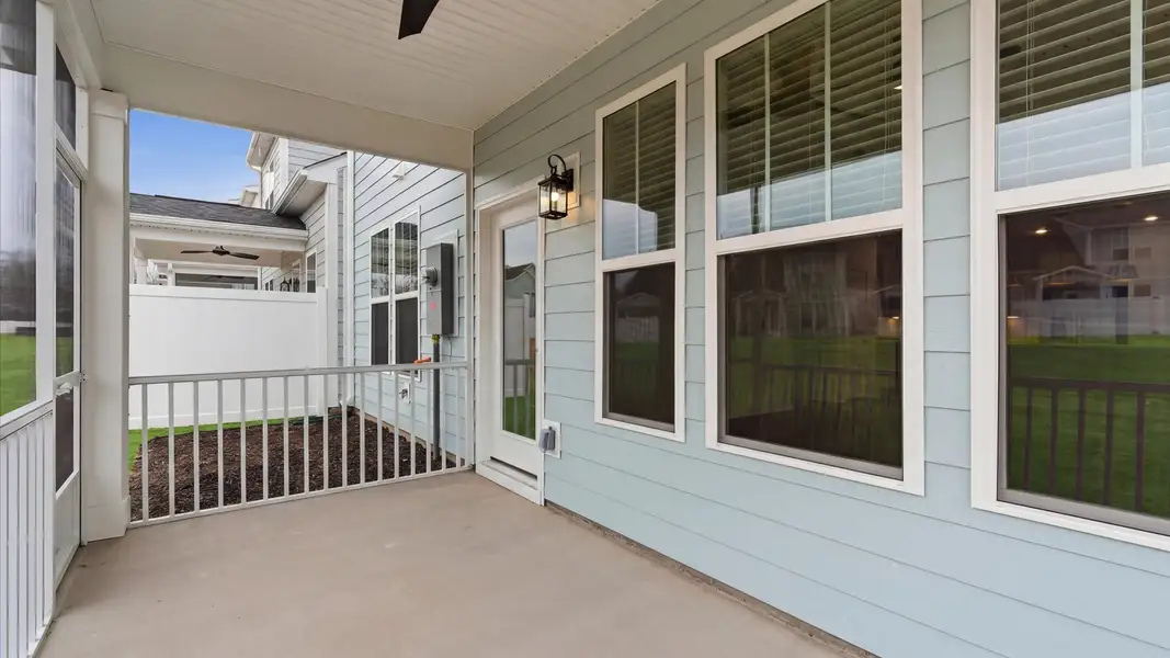 Exterior details and patio area of a home in Village at Midway, Anderson (Image 4).