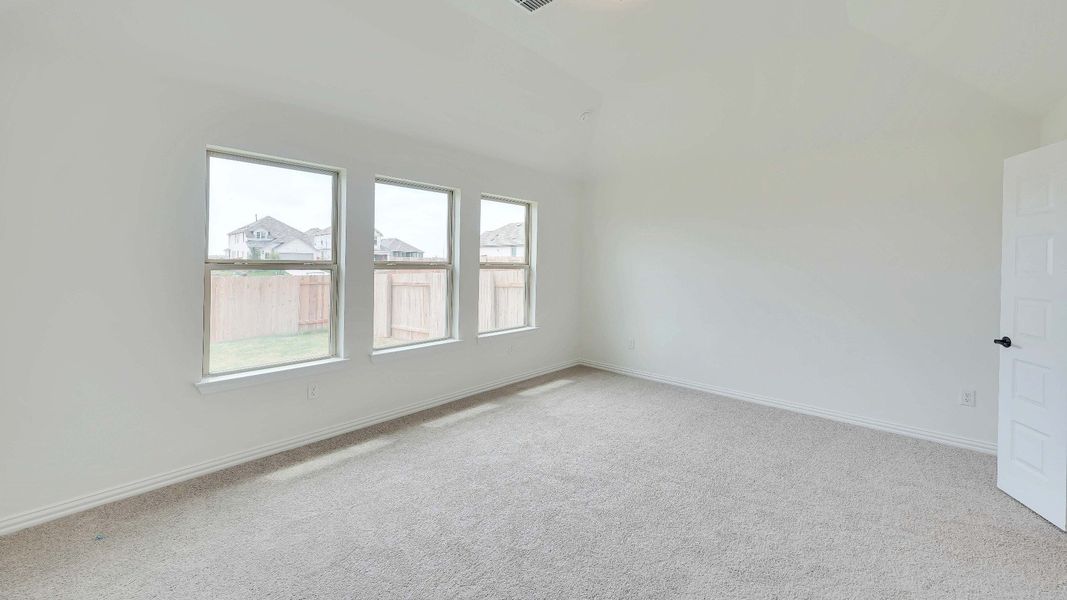 Representative furnished interior of a home built from the Palm by Brightland Homes in Sunterra, Katy (Image 12).