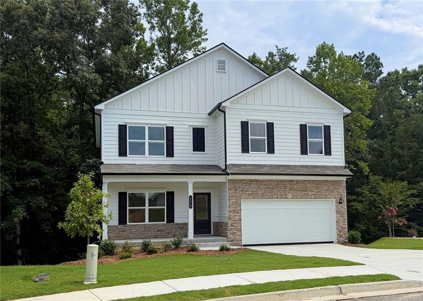 Front exterior of a new home in Jones Ridge, Dallas, GA, highlighting curb appeal (Image 1). Front exterior of a new home in Jones Ridge, Dallas, GA, highlighting curb appeal (Image 1).