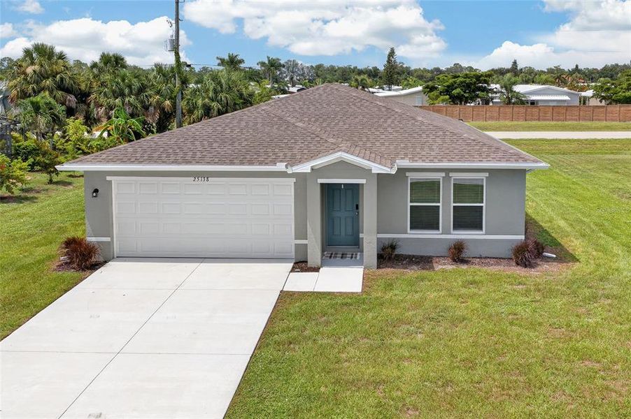 Front exterior of a new home in , Punta Gorda, FL, highlighting curb appeal (Image 26). Front exterior of a new home in , Punta Gorda, FL, highlighting curb appeal (Image 26).