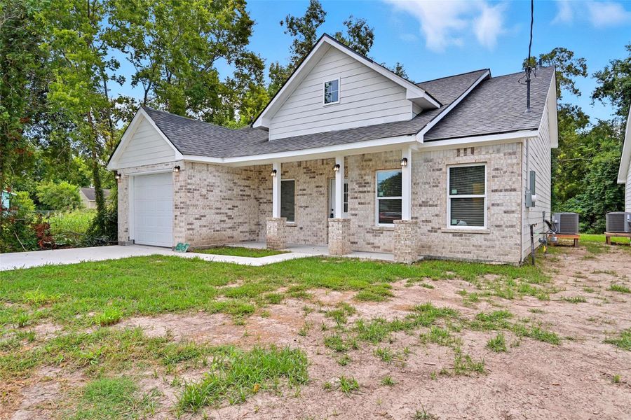 Front exterior of a new home in , Texas City, TX, highlighting curb appeal (Image 21). Front exterior of a new home in , Texas City, TX, highlighting curb appeal (Image 21).