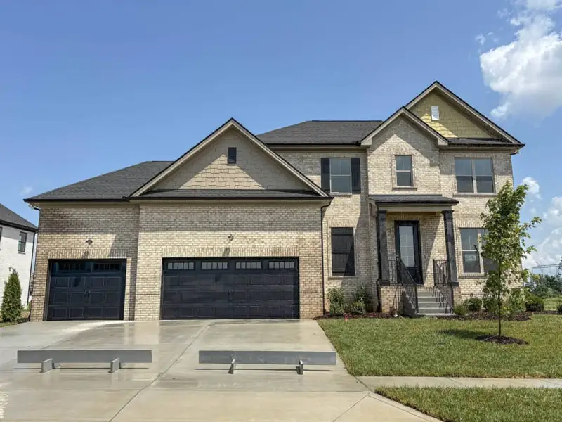 Front exterior of a new home in Westfield Carriage Homes, Gallatin, TN, highlighting curb appeal (Image 1). Front exterior of a new home in Westfield Carriage Homes, Gallatin, TN, highlighting curb appeal (Image 1).