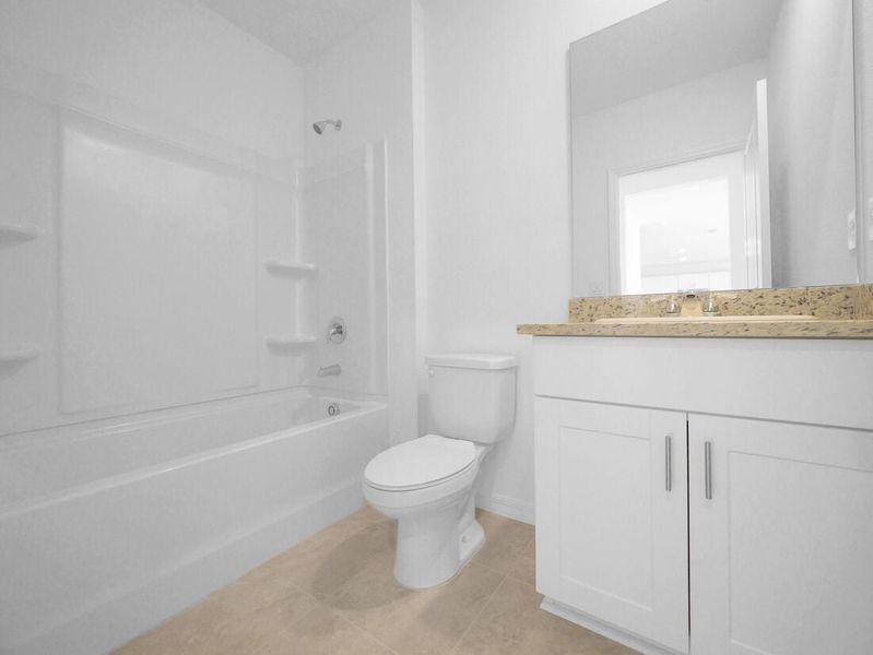 Representative furnished interior of a home built from the Azalea by Taylor Morrison in Palm Wind, Hudson (Image 32).