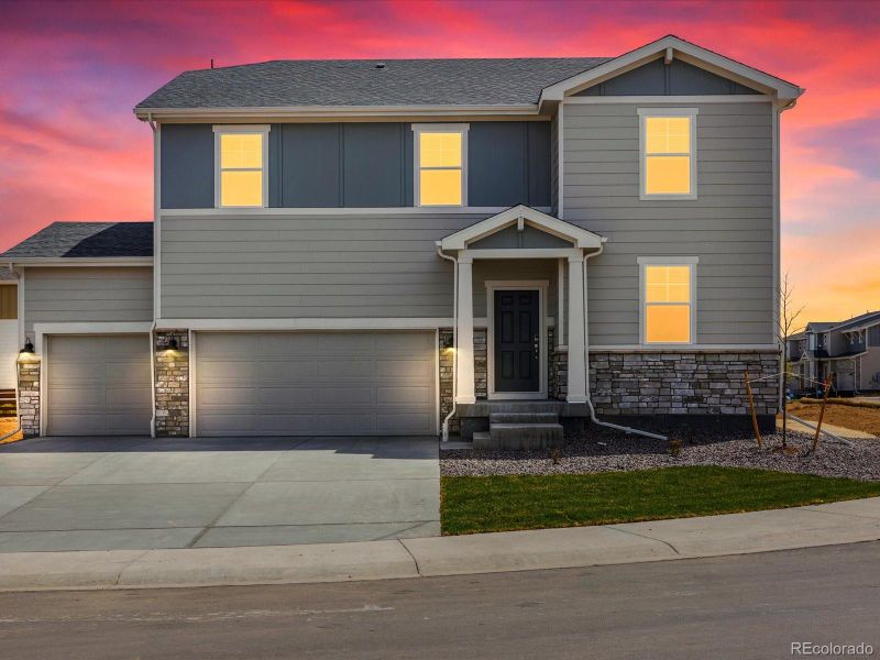 Front exterior of a new home in Revere at Johnstown, Johnstown, CO, highlighting curb appeal (Image 2). Front exterior of a new home in Revere at Johnstown, Johnstown, CO, highlighting curb appeal (Image 2).