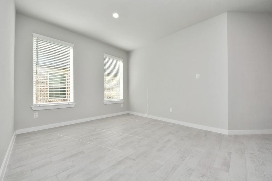 Make memories gathered around the table with your family and friends! This spacious dining room features elegant flooring, custom paint, and adjacent to family room and kitchen for open concept feel. Sample photo of completed home with similar floor plan. Actual colors and selections may vary.
