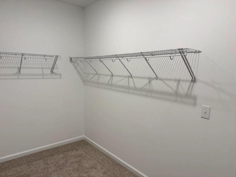 Primary Walk-In featuring the AW Collection® Artisan - Simple, spacious, and effortlessly styled. Primary Walk-In featuring the AW Collection® Artisan - Simple, spacious, and effortlessly styled.