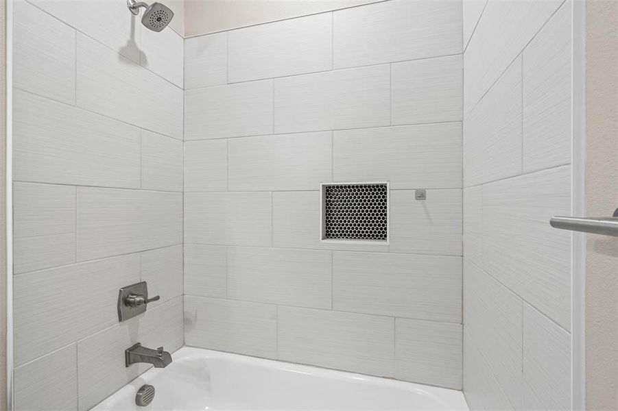 Bathroom featuring shower / bath combination Bathroom featuring shower / bath combination