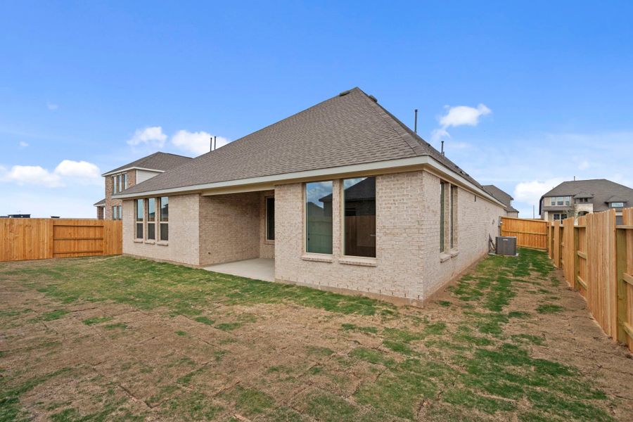 Exterior details and patio area of a home in Sunterra Lakes, Brookshire (Image 3).